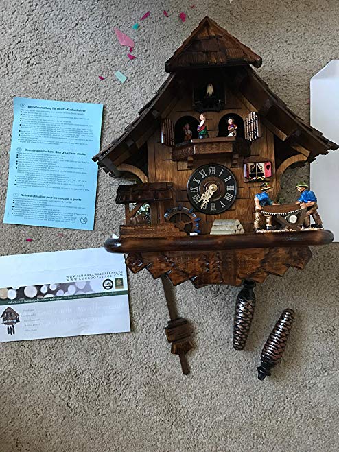 Quartz Cuckoo Clock Black Forest house with moving sawyer couple and mill wheel, with music